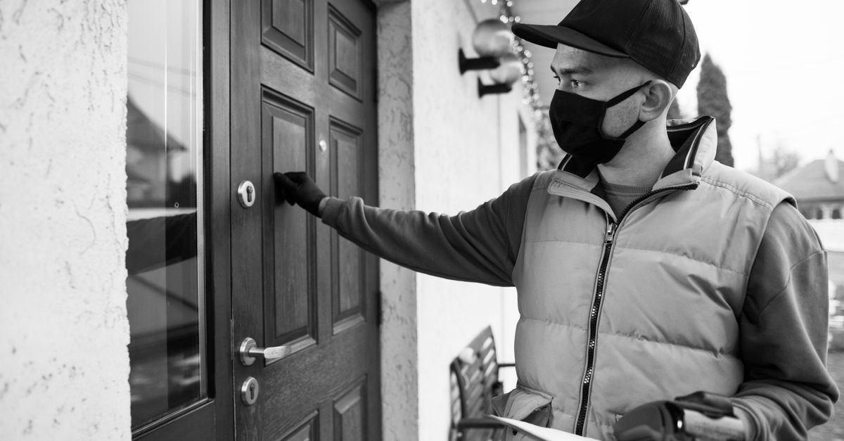 locksmith unlocking front door — Midtown Locksmith NYC Inc